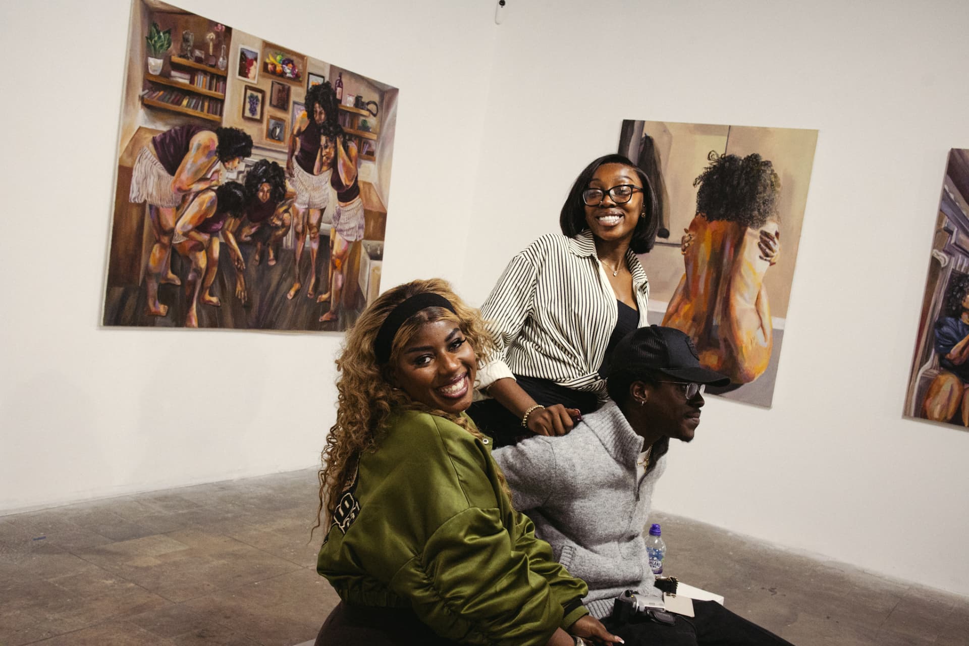 Visitors viewing paintings at a ShadesOf exhibition